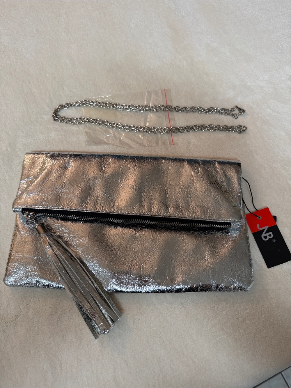Metallic Silver Fold-Over Tassel Clutch with Chain Strap